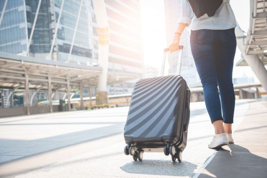 BT_GettyImages-1051367290_resized_Woman-With-Luggage-At-Airport-1408x888.jpg